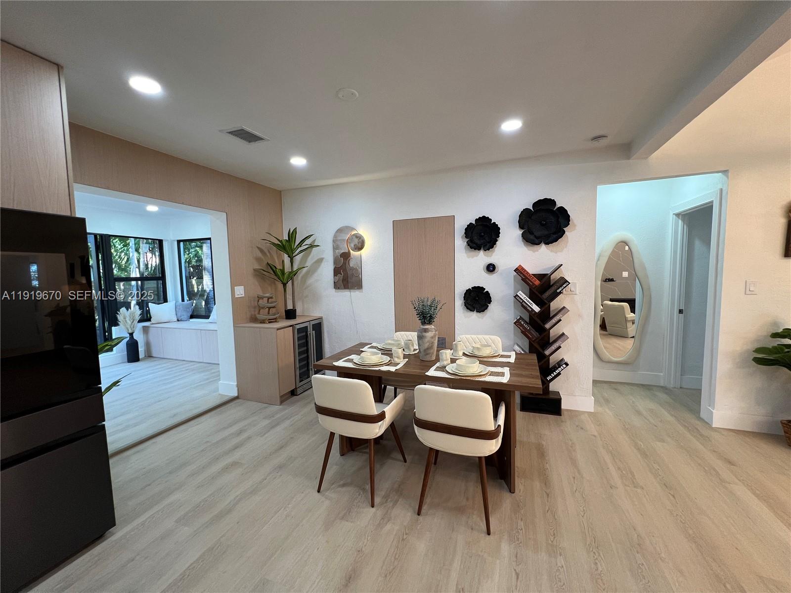 751 Northeast 80th Street Miami, FL 33138 - Photo 8 of 32 a living room with furniture and wooden floor