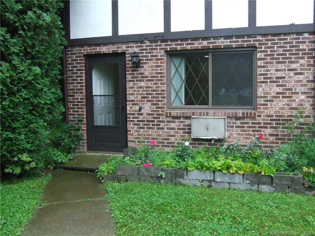 a view of house with backyard space and garden