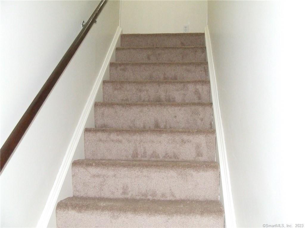 2 Branch Road, Unit 6A Thomaston, CT 06787 - Photo 12 of 19 a view of staircase with white walls