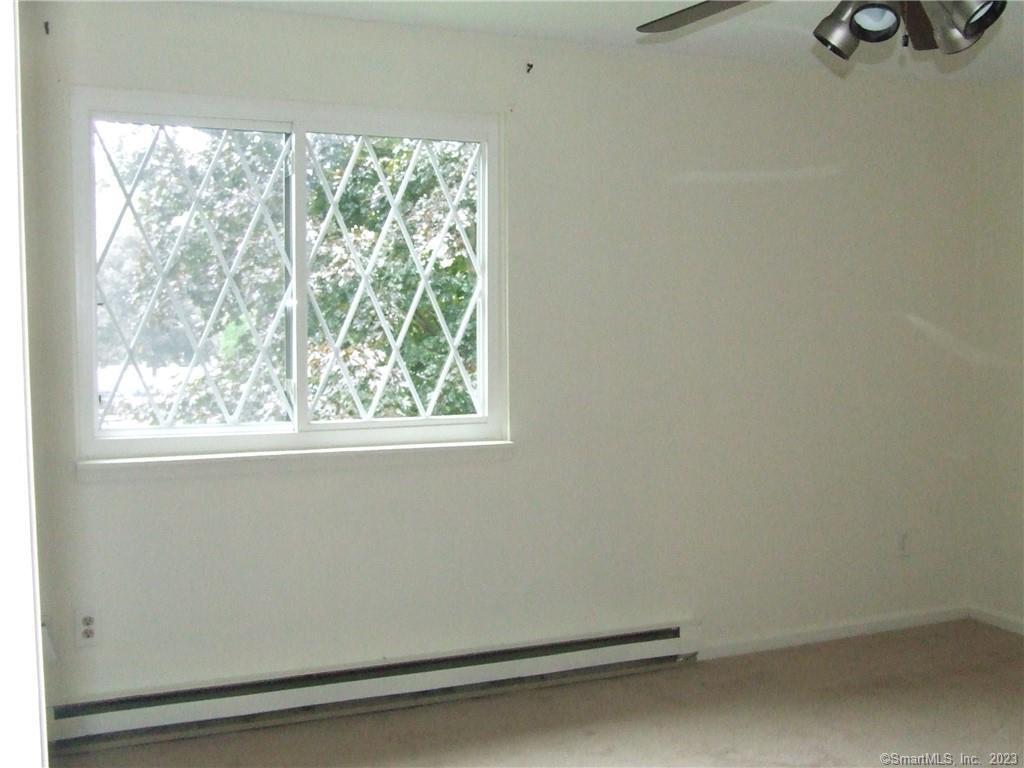 2 Branch Road, Unit 6A Thomaston, CT 06787 - Photo 13 of 19 an empty room with a window