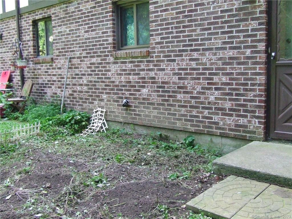 2 Branch Road, Unit 6A Thomaston, CT 06787 - Photo 3 of 19 a view of a brick wall
