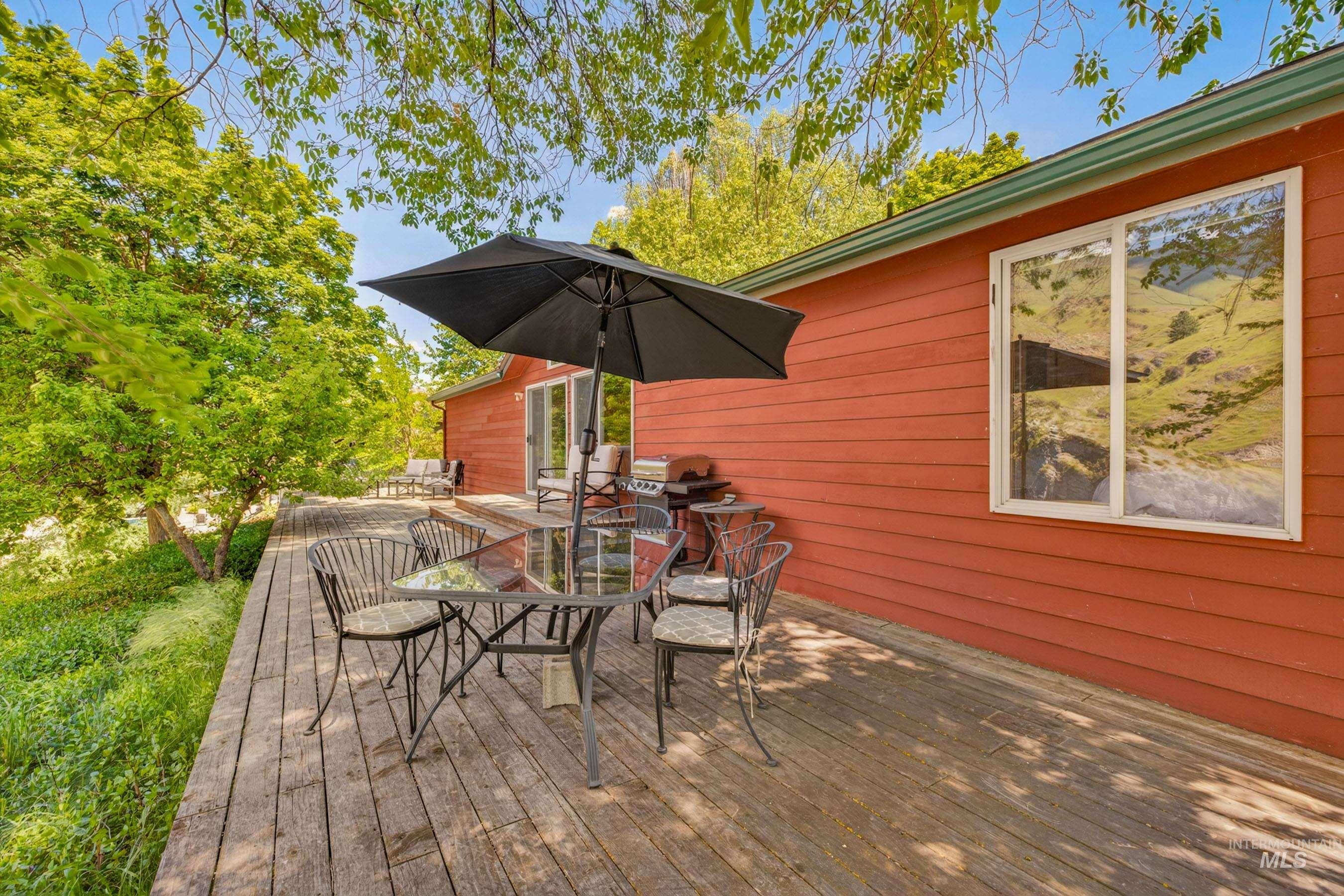 151 Cow Creek Road Lucile, ID 83542 - Photo 38 of 50 Spacious wood-finish deck with ample room for outdoor dining and entertaining