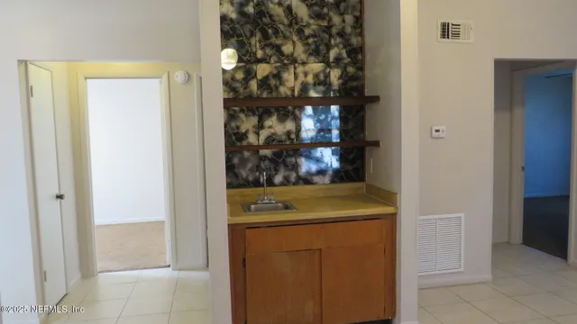 a bathroom with a shower curtain and a toilet