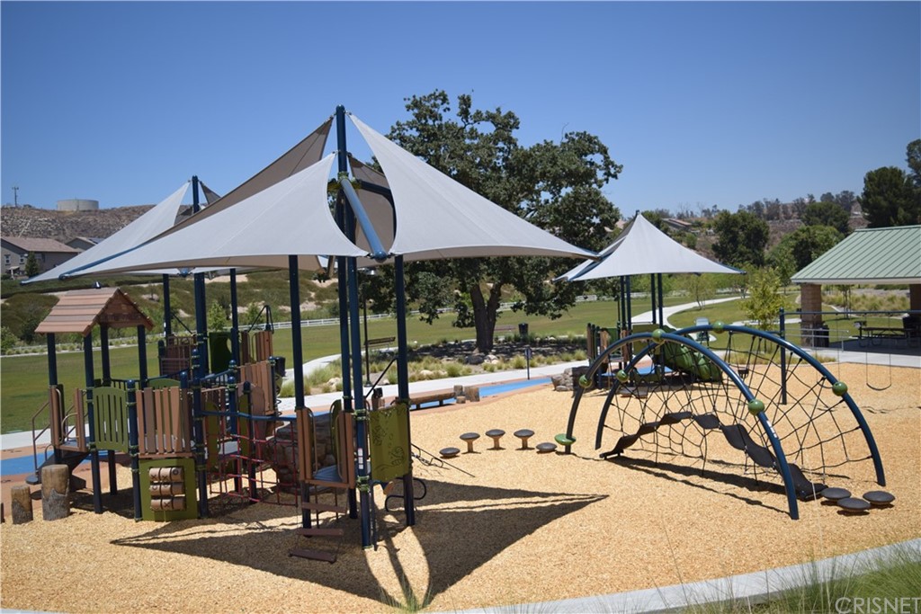 26500 Township Street Saugus, CA 91350 - Photo 13 of 20 a view of a swimming pool with a table and chairs