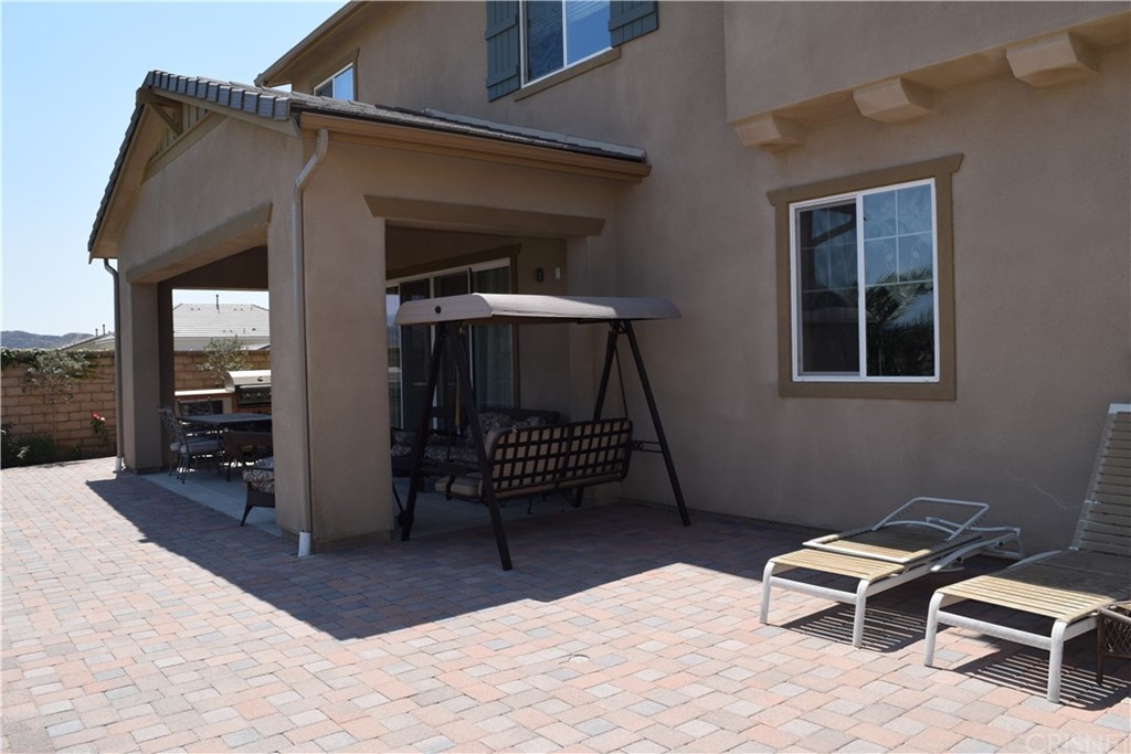 26500 Township Street Saugus, CA 91350 - Photo 3 of 20 a building outdoor space with patio furniture and potted plants