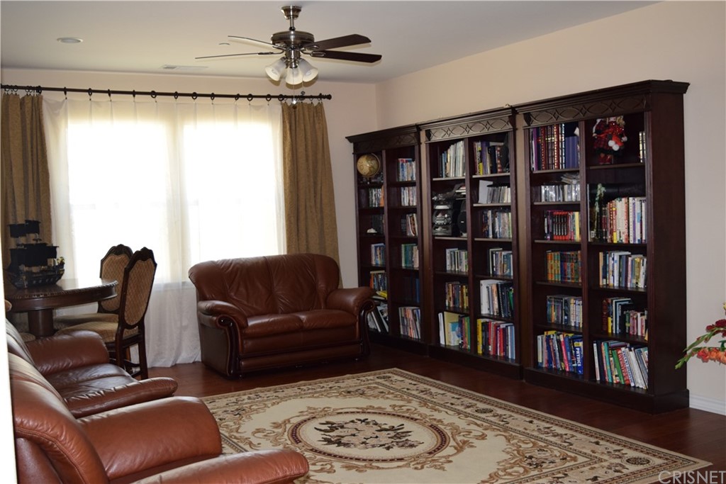 26500 Township Street Saugus, CA 91350 - Photo 10 of 20 a living room with furniture and a book shelf