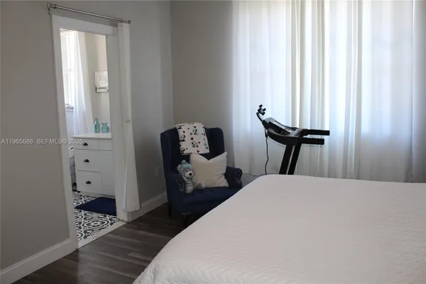 a bathroom with a shower curtain and a toilet