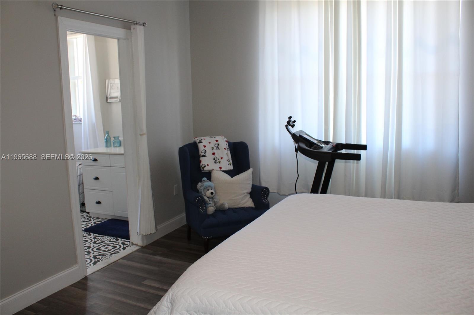 20135 Southwest 129th Avenue Miami, FL 33177 - Photo 14 of 54 a bedroom with a bed and wooden floor