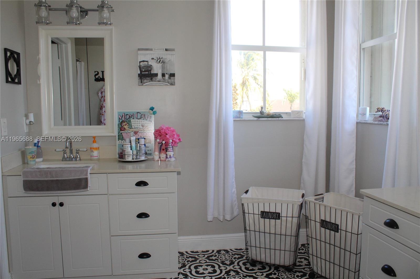 20135 Southwest 129th Avenue Miami, FL 33177 - Photo 15 of 54 a bathroom with a sink and a window