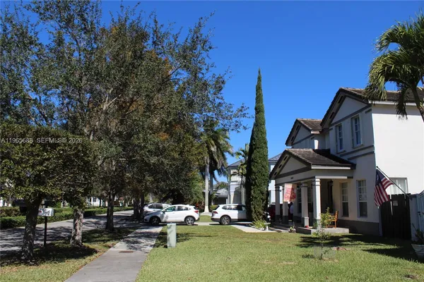 a view of a building with a yard