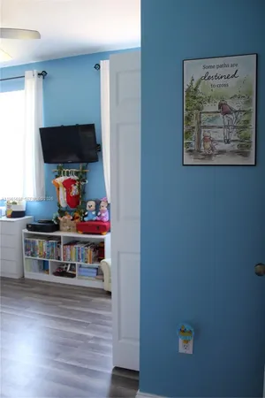 a room with furniture and a flat screen tv