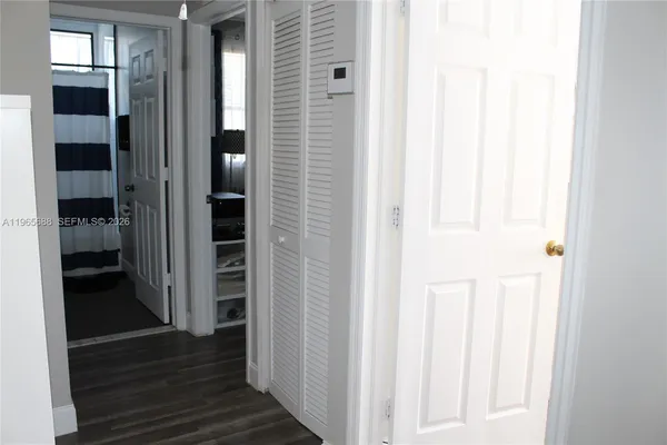 a bathroom with a bathtub a toilet and a shower