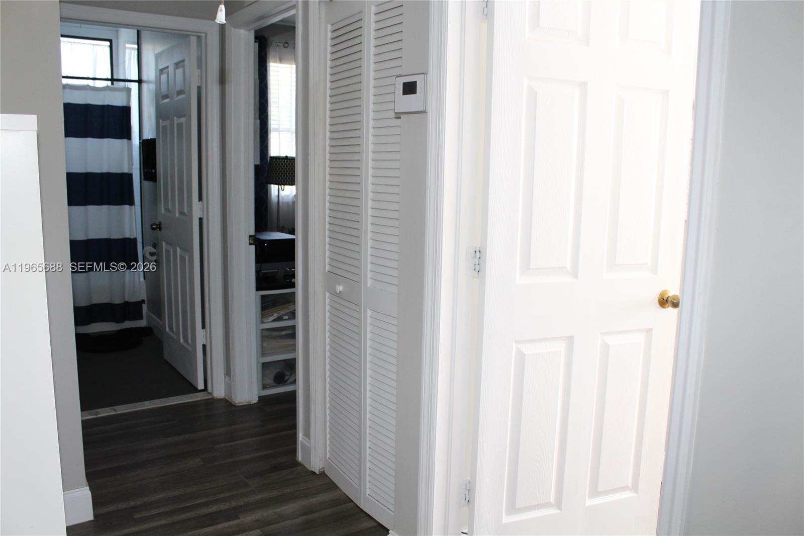 20135 Southwest 129th Avenue Miami, FL 33177 - Photo 25 of 54 a view of a hallway with wooden floor and entryway