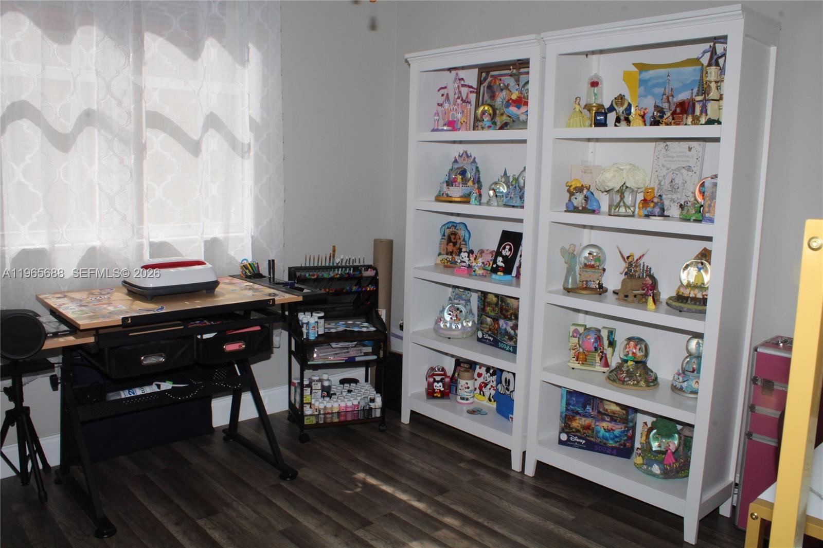 20135 Southwest 129th Avenue Miami, FL 33177 - Photo 26 of 54 a living room with furniture and a book shelf