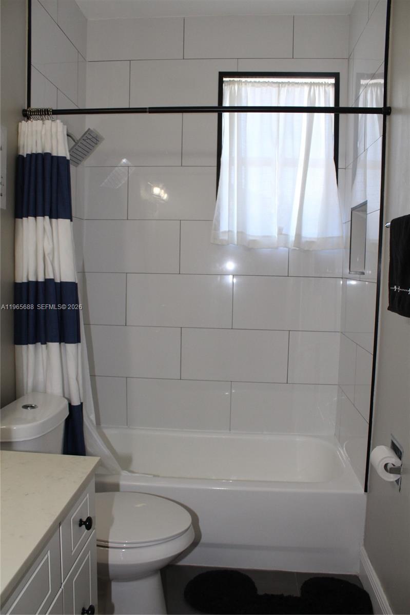 20135 Southwest 129th Avenue Miami, FL 33177 - Photo 28 of 54 a bathroom with a bathtub a toilet and a shower