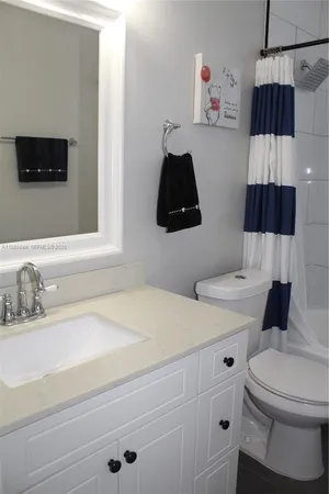 a living room with furniture and a lamp