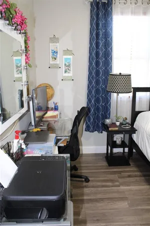 a room with furniture and a flat screen tv