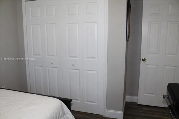 a bedroom with furniture and a book shelf