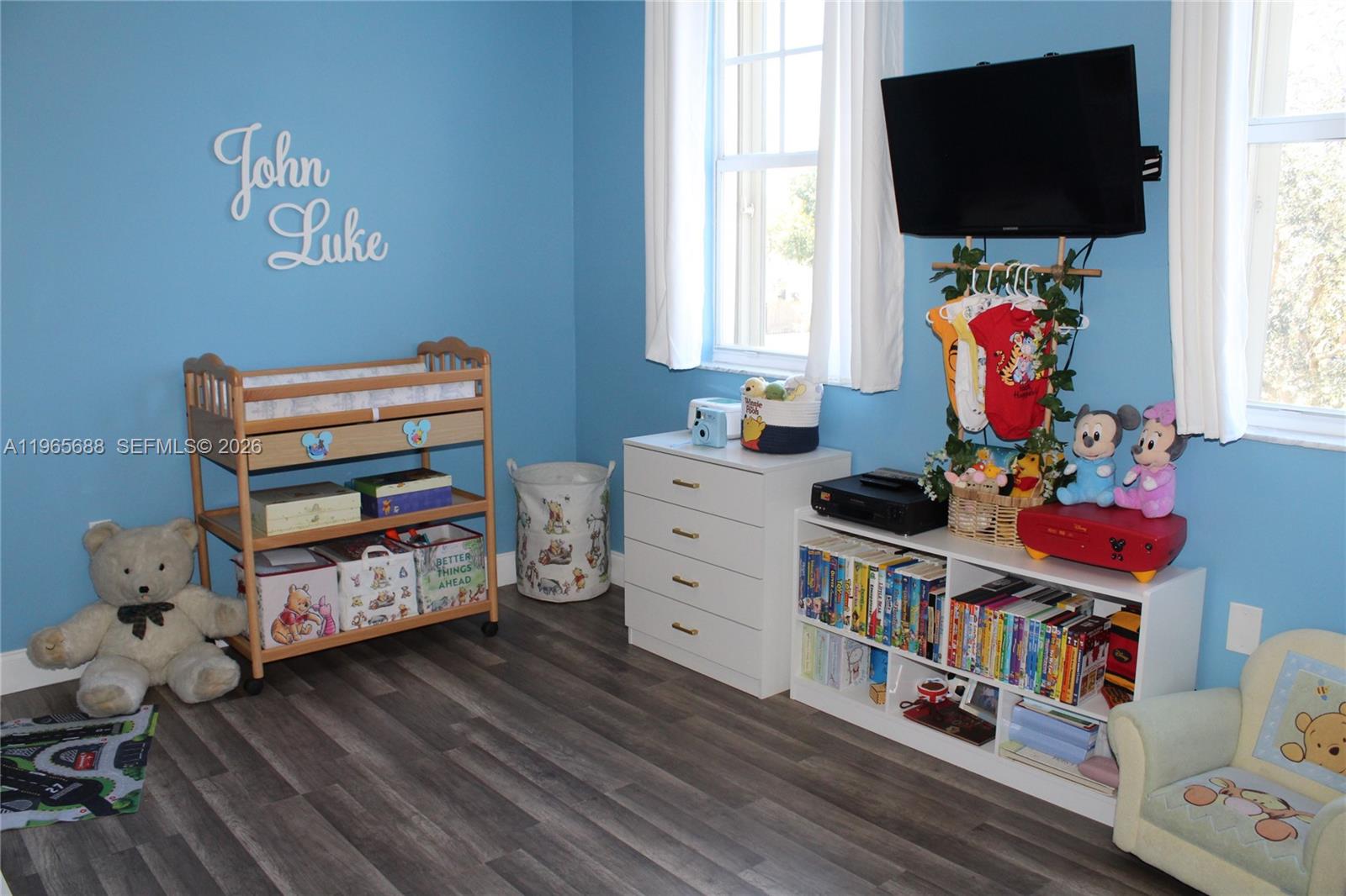 20135 Southwest 129th Avenue Miami, FL 33177 - Photo 35 of 54 a room with furniture and a flat screen tv
