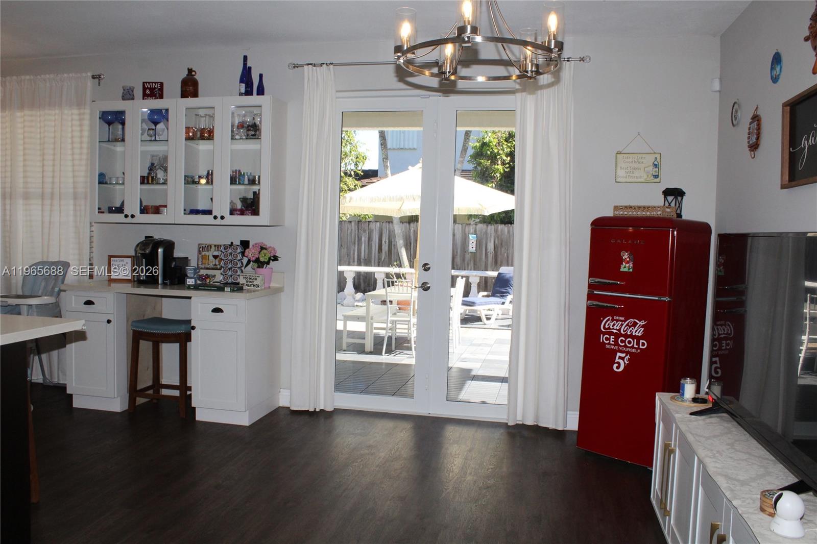 20135 Southwest 129th Avenue Miami, FL 33177 - Photo 37 of 54 a view of a kitchen with refrigerator and wooden floor