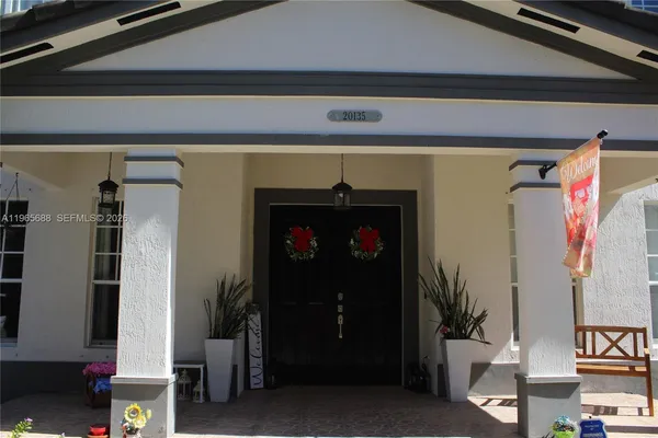 a front view of house with yard outdoor seating and barbeque oven