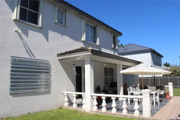 a living room with furniture a table and chair