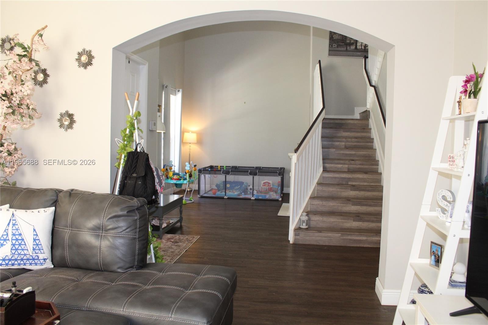 20135 Southwest 129th Avenue Miami, FL 33177 - Photo 6 of 54 a living room with furniture and a fireplace