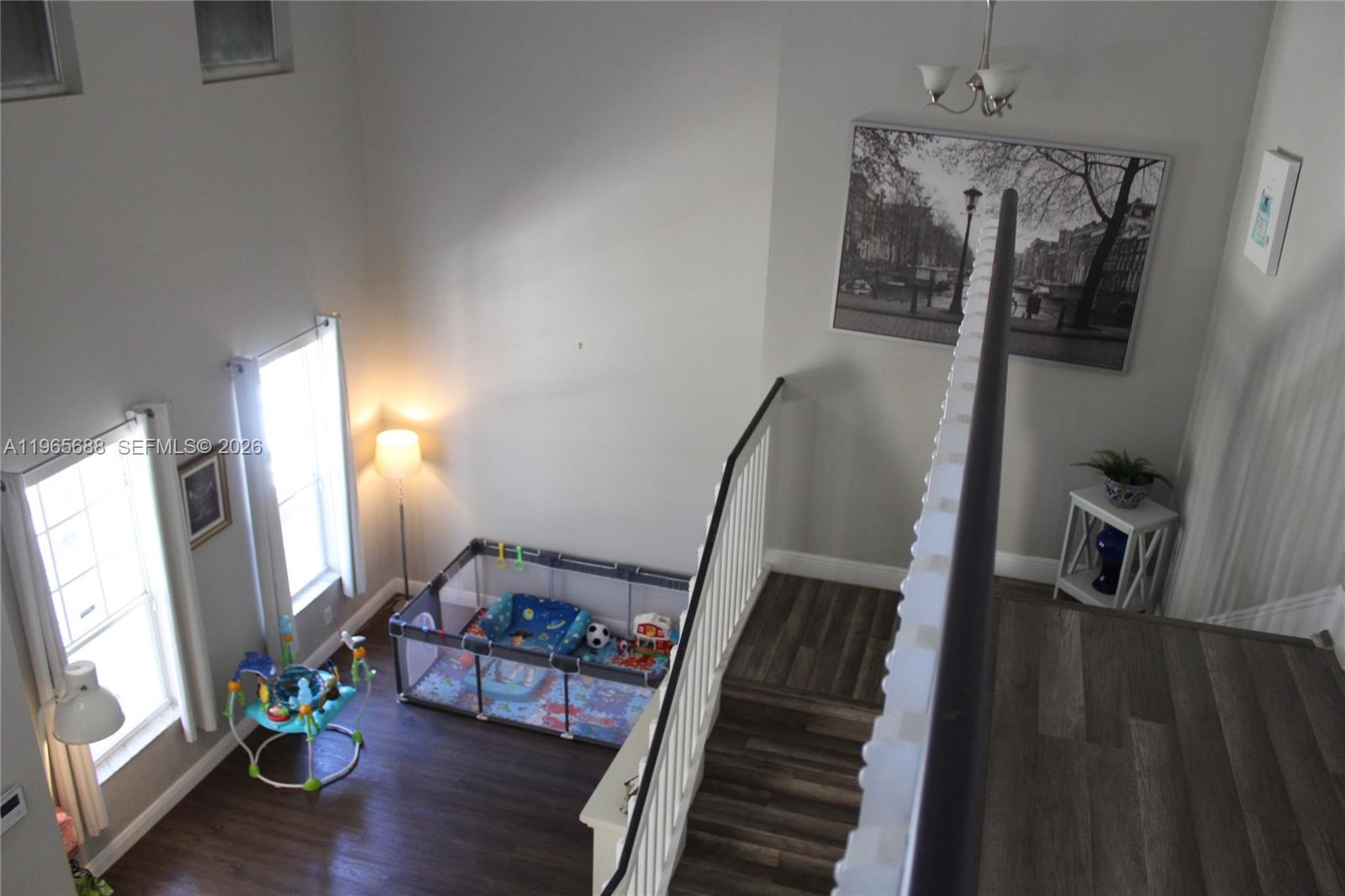 20135 Southwest 129th Avenue Miami, FL 33177 - Photo 10 of 54 a view of a hallway with furniture and wooden floor