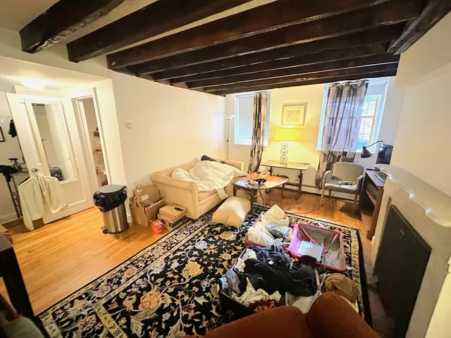 a very nice looking bedroom with a large window