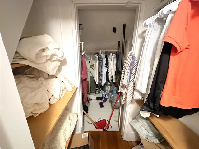 a view of a living room with bathroom