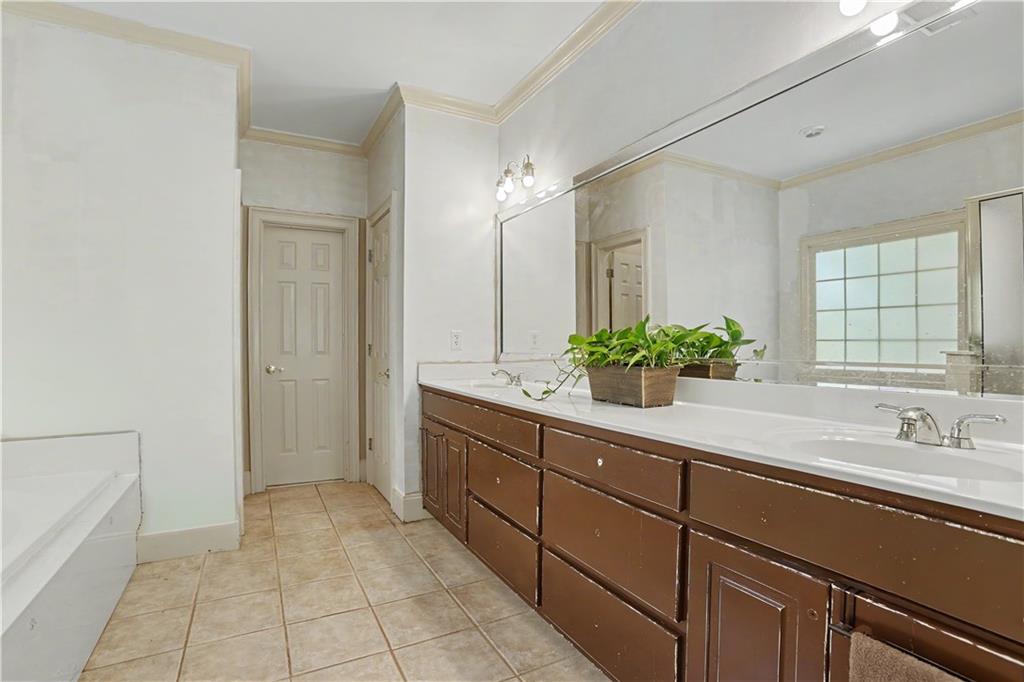 537 Old Collins Road Hoschton, GA 30548 - Photo 20 of 42 a bathroom with a sink and mirror