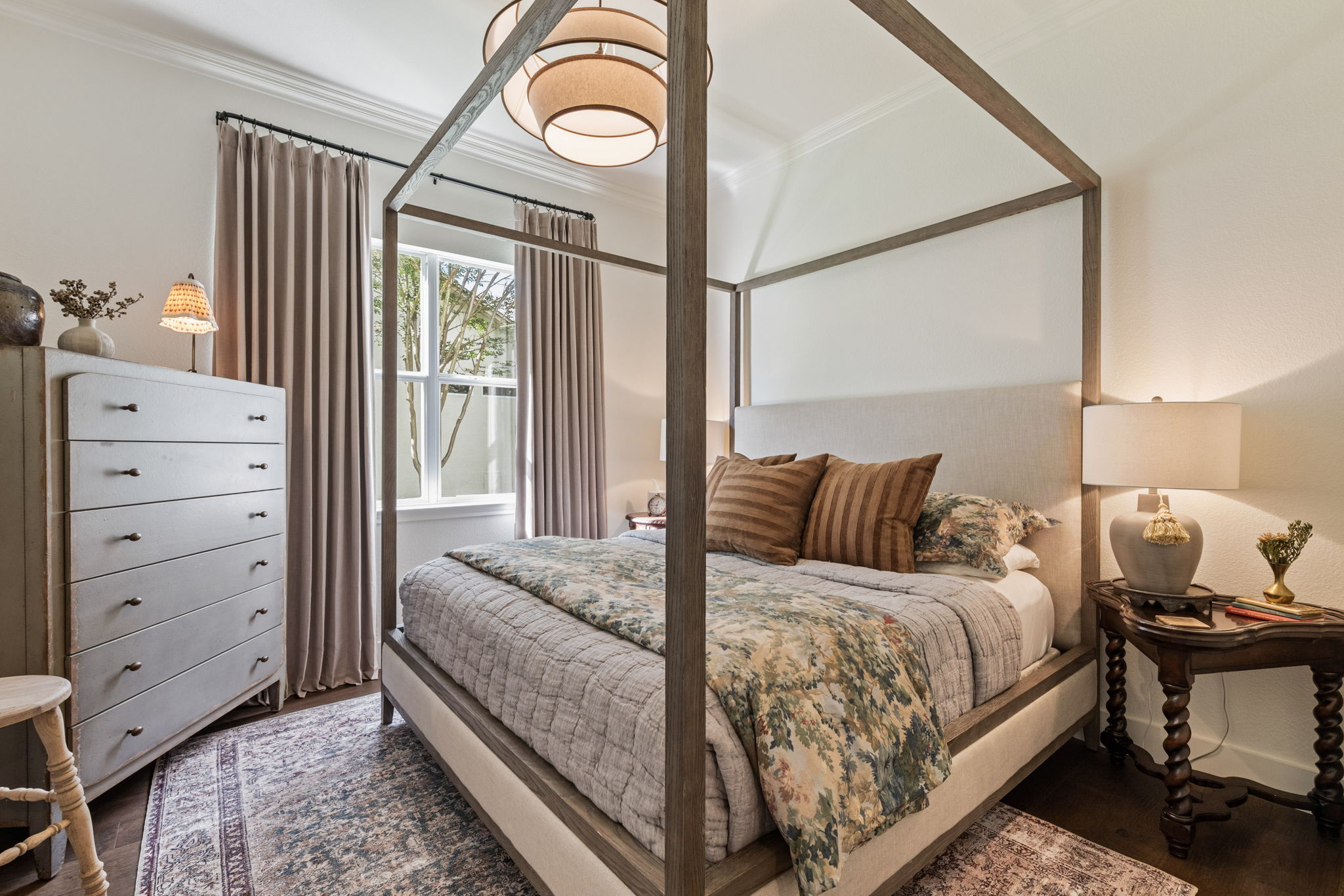 118 Cold Springs Drive Georgetown, TX 78633 - Photo 29 of 40 Relax in this inviting primary bedroom featuring a striking four-poster bed and elegant hardwood flooring.