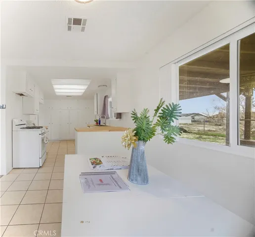 a bathroom with a sink a bathtub and a window