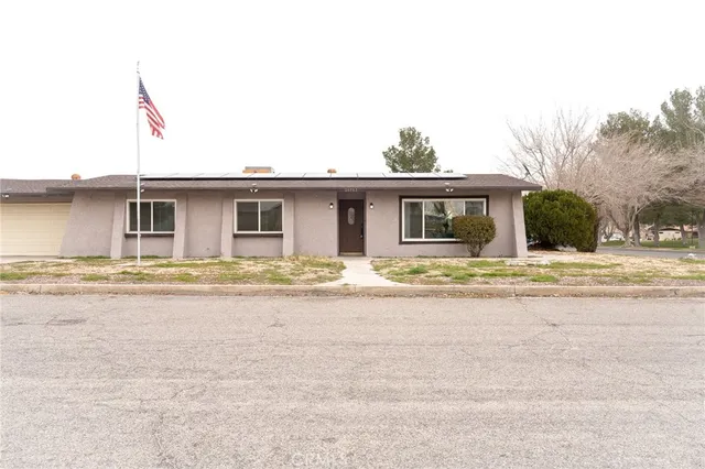 a front view of a house with swimming pool