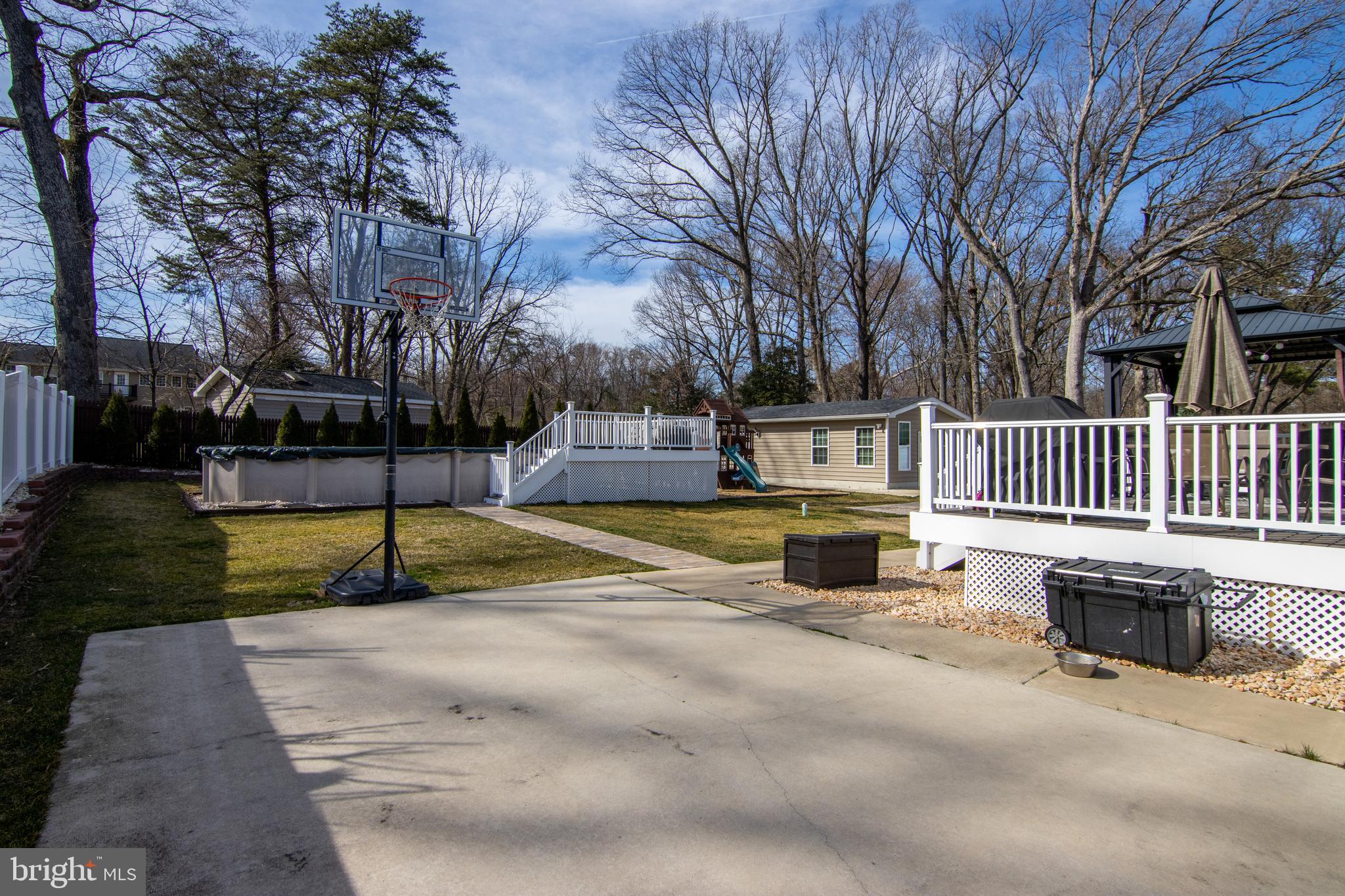 8 Holly Road Pasadena, MD 21122 - Photo 63 of 71 Concrete Basketball Court