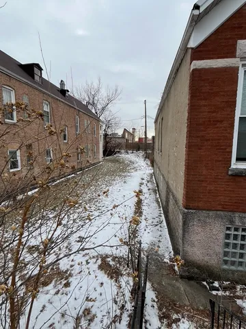 a view of a house with a snow