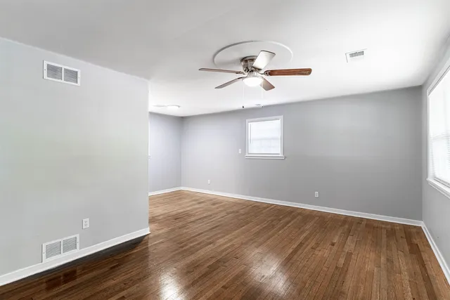 a view of room with hardwood floor and window