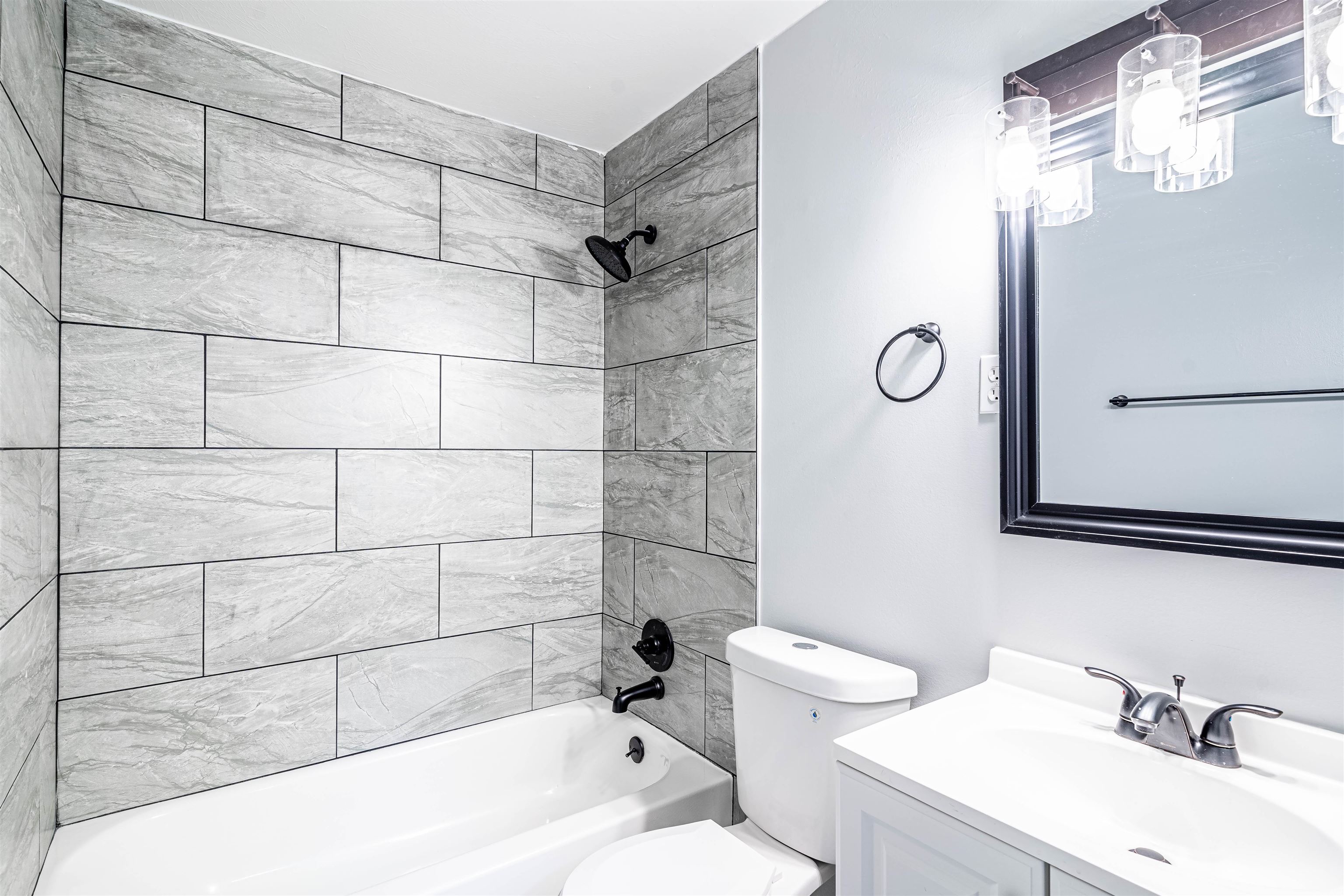 1141 South White Station Road Memphis, TN 38117 - Photo 7 of 9 a bathroom with a sink a toilet and shower