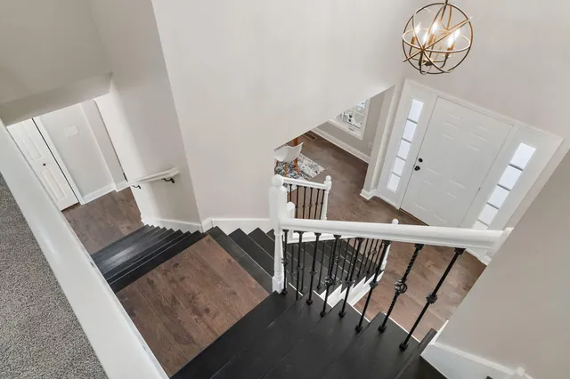 a view of staircase with wooden floor