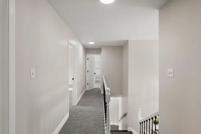 a bedroom with bed and a window