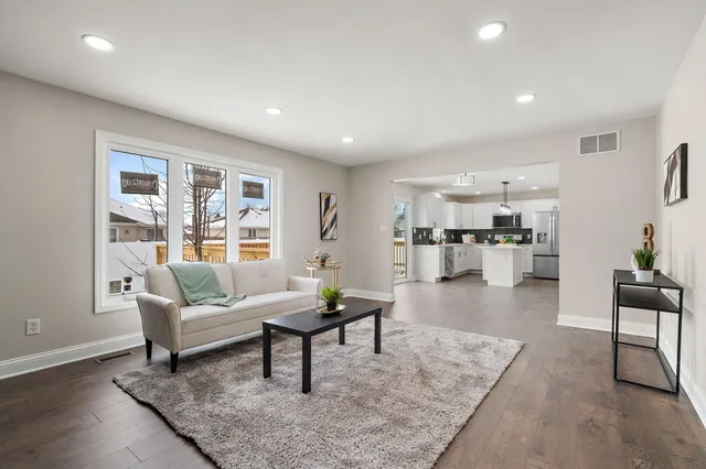 a living room with furniture and a table