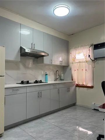 a kitchen with cabinets a sink and appliances