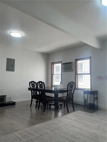 a view of a dining room with furniture and window