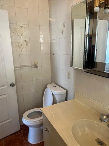 a bathroom with a sink and toilet