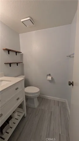 a bathroom with a toilet and a sink