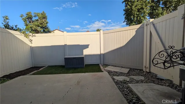 a view of a backyard with potted plants