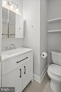 a spacious bedroom with a bed and a window