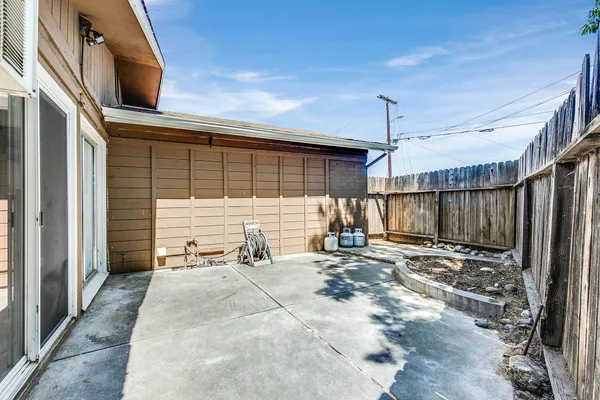a view of a backyard with a patio