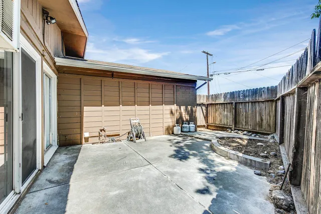 a view of a backyard with a patio