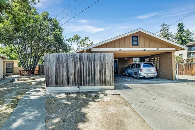 a view of a car park in front of house